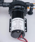 Close-up of diaphragm pump on Tow Behind Sprayer With 60 Gallon Capacity, 4 GPM, 100 PSI, showing part details and connectors.