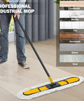 Heavy Hitter 24 Inch Commercial Dust Mop With Two Premium Microfiber Pads Large Indoor Dry Push Broom For Hardwood Tile And Laminate Floor No Sweat Jobs being used on a hardwood floor.