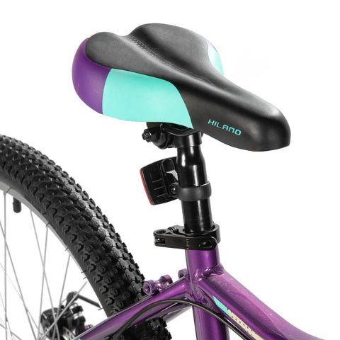 Purple saddle and part of frame on 26 Inch Mountain Bike For Women With 18 Speed Gears Front Suspension Aluminum Frame Adult Ladies Bicycle
