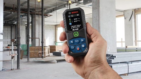 Blaze Green Beam Laser Distance Measure With 165 Foot Range And One Sixteenth Inch Accuracy in use at construction site