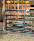 Farm gate with heavy duty gate hinges 2-pack wall mount 1-3/8 inch for chain link fence and wood gates installed on barn wall.