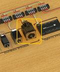 Two NEMA 34 integrated servo motors with built-in encoders on a bench, wired to a CAN bus controller and I/O blocks