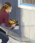 Person using iSpray Front End Nozzle For HVLP Sprayers Broad Interior And Exterior Coverage With Unthinned Coatings Delivers