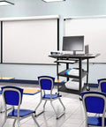 Four Pack Compact Mobile Charging Cart Bundle For Chromebooks Laptops And Tablets No Sweat Tech Storage With Power Strip Plug And Play Locking Cabinet Heavy Duty Wheels Top Shelf Classroom Gear in a classroom setup.