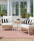 Two Pack Outdoor Throw Pillows 18x18 Inches All Weather Water Resistant With Inserts For Patio Furniture Couch Sofa Poolside Black White Decor Cushions on white wicker chairs