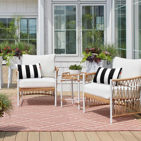 Two Pack Outdoor Throw Pillows 18x18 Inches All Weather Water Resistant With Inserts For Patio Furniture Couch Sofa Poolside Black White Decor Cushions on white wicker chairs