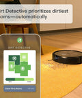 Self-Emptying Robot Vacuum With Ultra Strong Suction And Obstacle Detection, 60 Day Auto-Empty, Pet Friendly Cleaning, Smart Mapping, Alexa Compatible, Dirt Detective Intelligence Keeps Floors Spotless And No Fuss cleaning a carpet with dirt detection shown on a phone app.