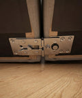 Close-up of six pack sectional sofa connectors with slide lock fasteners joining L shaped couches to eliminate gaps and wobble.