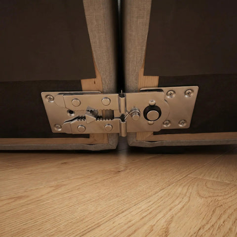 Close-up of six pack sectional sofa connectors with slide lock fasteners joining L shaped couches to eliminate gaps and wobble.