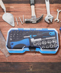 Gutsy Heavy Duty Ratchet Socket Wrench Kit With Extra Screwdriver Bits And A Snap Shut Carry Case on wooden surface
