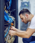Technician installing Dope 500 Foot Cat6 Bulk Ethernet Cable 23 AWG CCA UTP Indoor Network Cable Gray for fast LAN setup