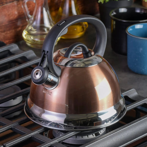 Copper finish Flintshire 1.75 Quart Stainless Steel Whistling Tea Kettle With Flip Up Spout Cover on stove