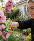 Person using 6.9 Inch Bypass Pruning Shears With Sharp SK5 Steel Blade For Roses Plants Flowers And Fruits in garden