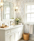 Beige Floral Peel And Stick Wallpaper With Delicate Arched Accents in a styled bathroom with white cabinets and decor.