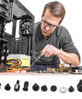 Man assembling PC with 420 Pcs Computer Screws And Standoffs Kit for motherboard, laptop, PC case fans, HDD, SSD hardware.