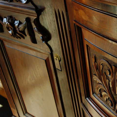 Elegant wood cabinet with carved details and view of installed Art Deco Leaf Brass Cabinet Pulls 2.7 Inch Set Of 2 For Furniture And Interior Design Projects, Solid Brass Architectural Hardware With Elegant Leaf Motif, Durable Reliable Drawer Handles For Cabinets And Desks, Easy Installation With Soft Joining Pins.