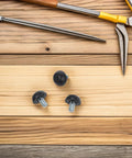 Heavy Duty Adjustable M8 Threaded Furniture Leveling Feet Set Of 20 With Precise Height Adjustment And Easy Install For Tables Desks And Beds Durable Plastic And Metal Construction black threaded feet on wooden surface