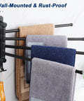 Top Shelf Swivel Towel Rack Built From Solid 304 Steel Spacious Four Arm Wall Mount Bath Station Sporting Rustproof Spin Nifty Side Hook And Chill Matte Black Finish with towels hanging.