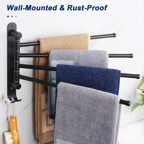 Top Shelf Swivel Towel Rack Built From Solid 304 Steel Spacious Four Arm Wall Mount Bath Station Sporting Rustproof Spin Nifty Side Hook And Chill Matte Black Finish with towels hanging.