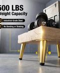 Heavy Duty 4 Inch Furniture Legs Set of 4 in Satin Gold with industrial steel build, supporting wooden table with weights, 500 lbs capacity.
