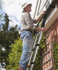 Man using 12.5 Foot Telescoping Aluminum Ladder For Home DIY And Outdoor Use, Multi Purpose Extension Ladder For Household And RV