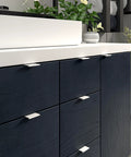 Lincoln Collection 1 5/16-Inch Center-To-Center White Modern Cabinet And Drawer Edge Pull Handle installed in a kitchen cabinet