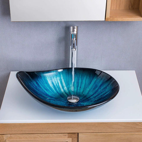 Blue Tempered Glass Vessel Sink With Faucet And Drain Above Counter Bathroom Upgrade Water Drop Style Chrome Finish Premium Modern Glass Sink Combo For Easy Install And Statement Look, showing water flow from chrome faucet