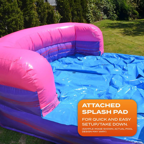 Close-up of purple dual-lane bounce house with slide, blue attached splash pad, 15oz PVC for indoor/outdoor use.