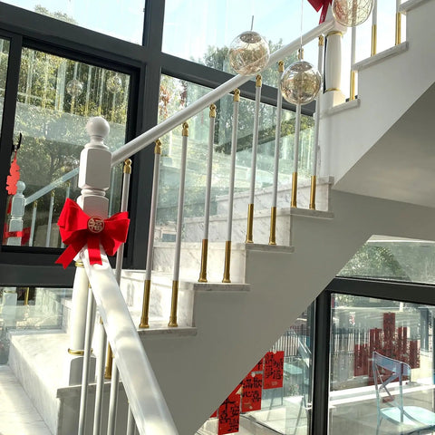 White Aluminum Railing Posts 37.4 Inch Deck Spindles 100 Pack With Adjustable Connectors And Shoe Base 270 Degree Angle Changeable No Sweat Setup Guardrail Uprights For Stairs installed in modern staircase with decorative elements.