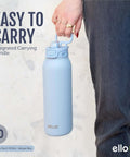 Pop And Fill 22oz Stainless Steel Water Bottle With Quick Fill Lid Pistachio shown being carried by a person