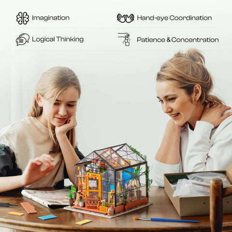 Mother and daughter assembling DIY Miniature Greenhouse Kit With Dope LED Lights 1 To 24 Scale Wooden Dollhouse at table.
