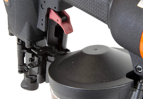 Close-up of Pro Grade Pneumatic Coil Roofing Nailer for three quarters inch to one and three quarters inch nails showing jam release.