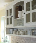 White kitchen cupboard with elegant cabinet doors featuring black 1.2 inch knobs from Set Of 30 Round Black Cabinet Knobs 1.2 Inch For Kitchen Cupboard Doors And Drawer Pulls Dope Sleek Solid Stainless Hardware With Screws For Dresser Furniture For Home Improvement And Easy Installation.