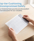 Person using 200 Pack Foam Packing Pouches And Sheets Cushion Wrap 11.8x9.8 Inch Double Layer Protection For Moving Glassware Dishes Cups