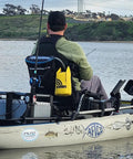 Person kayaking with All In One Boating Safety Dry Bag Kit With IP68 Waterproof Flashlight visible on watercraft