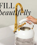 High Temperature Control Electric Kettle With 1500W Rapid Boil And Keep Warm Function Glass Body BPA Free Design White And Gold Finish being filled with water
