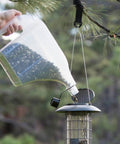 3N1 Bird Seed Super Tote And Storage For 5 Lb Capacity Carry Pour And Store Seed Easily With A Tapered Pour Spout in use