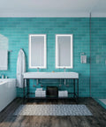 Modern bathroom with turquoise tiles, featuring a double sink vanity, large mirrors, and a walk-in shower with chrome fixtures.