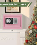 Pink Mini Safe Box With Code And Keys, Small Home Money Safe, 0.236 Cubic Feet, on mantel near Christmas tree.