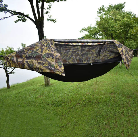 All In One Camping Hammock Tent With Mosquito Net And Rain Fly 3 In 1 Outdoor Hammock setup in grassy area