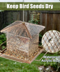 Built Tough Outdoor Hanging Bird Feeder with Waterproof Metal Build in rain showcasing large seed capacity and copper detail.