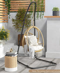 Beefy Outdoor Hammock Stand With Adjustable Height, Heavy Duty Metal Swing Frame for Porch, Black, shown on patio without chair