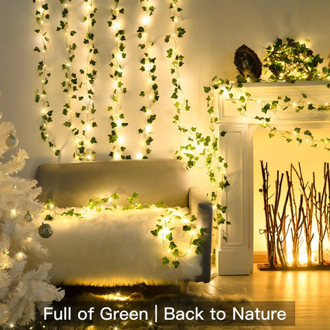 Vine With Fairy Lights Battery Operated 33Ft 100 LED Pothos String Lights decorating living room with greenery.