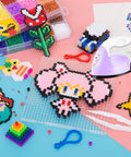Portable Mini Heat Press Machine With Charging Base For DIY T Shirts Bags And Hats Light Purple Compact Small Iron Craft Tool For Vinyl Projects positioned among colorful bead designs.