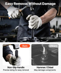 Bearing Press Kit With 52 Piece Bearing Race And Seal Driver Set including handle shaft in use for smooth bearing removal.