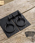 Colonial Style Iron Gate Latch Black Flip Latch Heavy Duty Cast Iron Drop Latch for barns, sheds, cabinets, shutters shown on wood surface