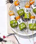 Plate of snacks with Big Edible Candy Eyeballs 10 Mm For Bold Decorating Pack Of 2 Jars 3 Oz Each Total 6 Oz arranged creatively.