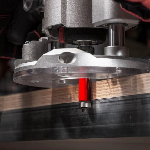 One Half Inch Bearing Flush Trim Router Bit With TiCo Hi Density Carbide for laminate work, shown installed in router.