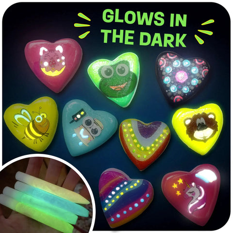 Glow In The Dark Heart Rock Painting Kit For Kids Ages 4 To 12, STEM Craft Set With Puffy Paint Stickers Gems And Paints, showing glowing rocks and paints under dark lighting.