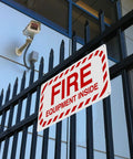 Fire Safety Warning Sign 8 By 12 Inch Aluminum Rustproof Metal Plate for indoor outdoor use mounted on black metal fence.